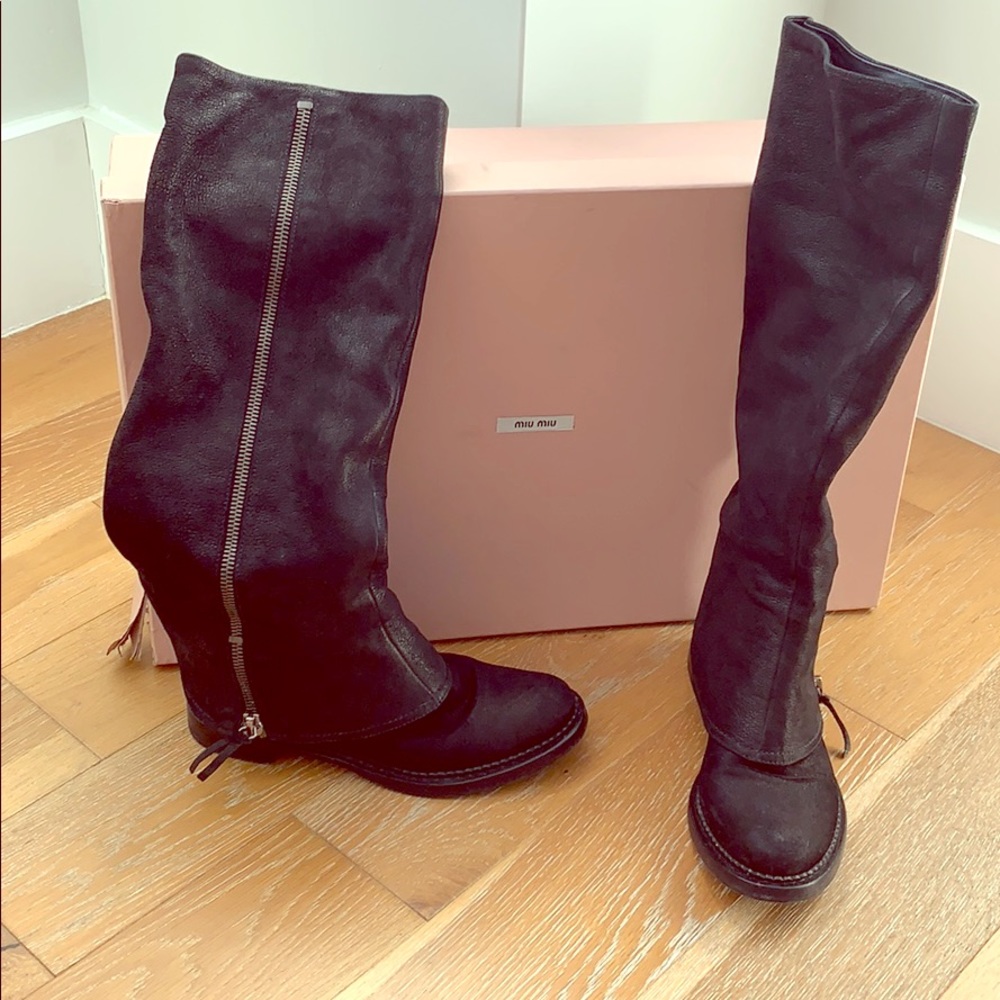 Miu Miu black leather boots.